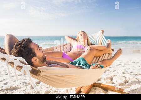 Couple lying in hammock Stock Photo