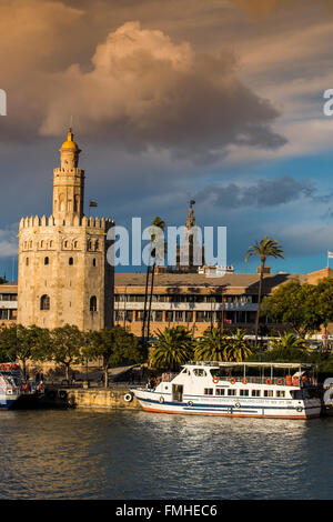 Torre del Oro watchtower with Giralda bell tower in the background, Seville, Andalusia, Spain Stock Photo