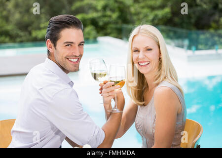 Portrait of smiling couple drinking wine Stock Photo