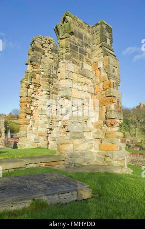 Ancient stone church with a free-standing bell tower under a bright ...