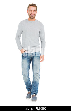 Young man standing with hands in pocket Stock Photo