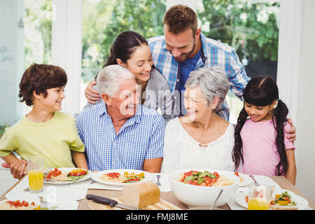 Multi generation family discussing at dining table Stock Photo