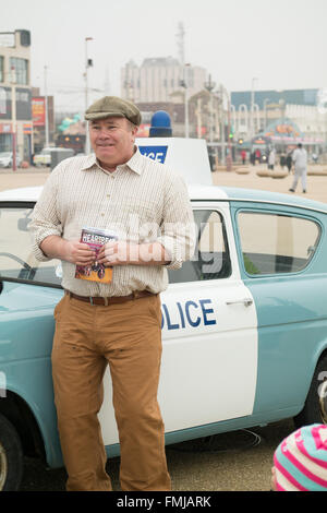 Blackpool,UK, 12th March 2016. Entertainment news. Actor David Lonsdale who plays the 'village fool' David Stockwell in the long running police series 'Heartbeat' promotes the new theatre tour based on the progamme at Blackpool's comedy carpet today. Posing for photograph's with the original police car from the show David speaks to members of the public to highlight this new theatre tour which starts at Blackpool's Grand Theatre on Wednesday the 16th of March. 2016. The nationwide tour finishes at Wolverhampton in July of this year Credit: Gary Telford/Alamy live news Stock Photo