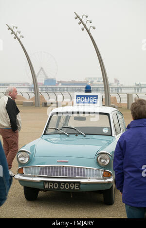 Blackpool,UK, 12th March 2016. Entertainment news. Actor David Lonsdale who plays the 'village fool' David Stockwell in the long running police series 'Heartbeat' promotes the new theatre tour based on the progamme at Blackpool's comedy carpet today. Posing for photograph's with the original police car from the show David speaks to members of the public to highlight this new theatre tour which starts at Blackpool's Grand Theatre on Wednesday the 16th of March. 2016. The nationwide tour finishes at Wolverhampton in July of this year Credit: Gary Telford/Alamy live news Stock Photo