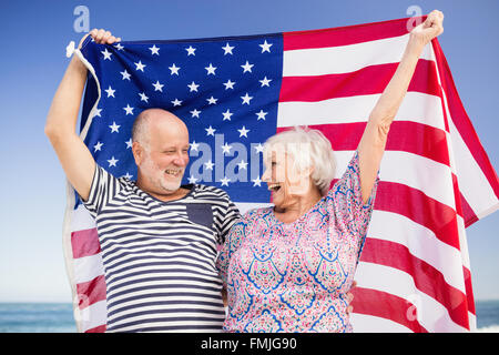 Senior couple holding american flag together Stock Photo