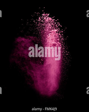 Explosion of pink powder on black background Stock Photo