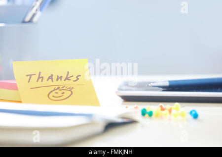 Thanks text on adhesive note at office Stock Photo