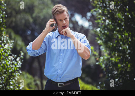 Focused man having a conversation on the phone Stock Photo