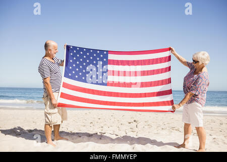 Senior couple holding american flag together Stock Photo