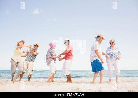 Happy senior couples dancing Stock Photo