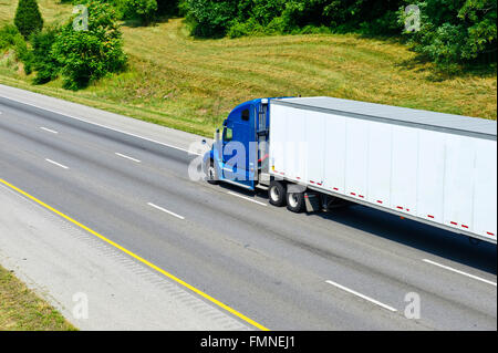 Single Blue Semi Truck On Interstate Highway Stock Photo