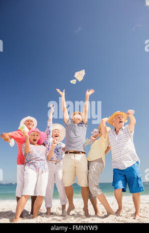 Happy senior throwing money Stock Photo