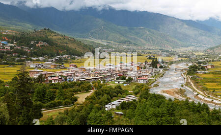 Overlooking Paro with the Paro River or Pa Chu and yellow rice fields, Paro valley, Himalayas, Kingdom of Bhutan Stock Photo