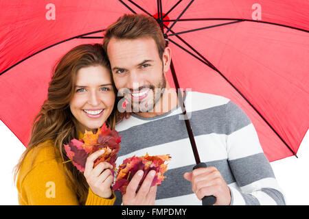 Happy young couple holding umbrella Stock Photo