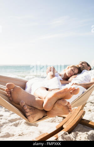Couple sleeping in hammock Stock Photo