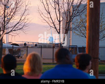 Dallas,USA 12 March 2016. President Obama arrived last night from his keynote address at the SXSW Conference in Austin, Texas. His over night stay in Dallas was followed by a full day of meetings and fund raising for the Democratic National Convention, followed by a round of golf. Air Force One can be seen in the background parked at DalFort Fueling at Love Field. President Obama departed Love Field shortly before 7 this evening on his return trip to Washington. Stock Photo