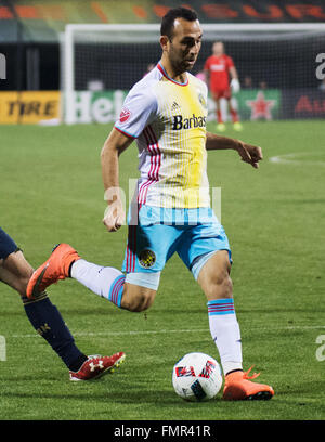 Columbus, Ohio, USA. 12th March, 2016. Columbus Crew forward Justin Meram (9) serves the ball into the middle in the nmatch against Philadelphia. Columbus, Ohio, USA Credit:  Brent Clark/Alamy Live News Stock Photo