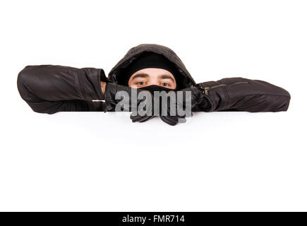 Thief lurking on white background Stock Photo