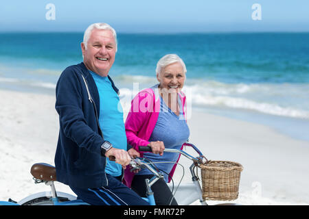 Mature couple riding bicycles Stock Photo