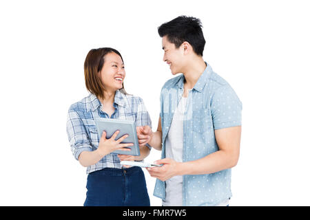 Happy young couple using digital tablet Stock Photo