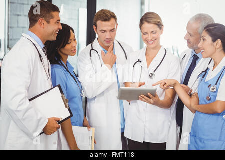 Medical team interacting and using digital tablet Stock Photo