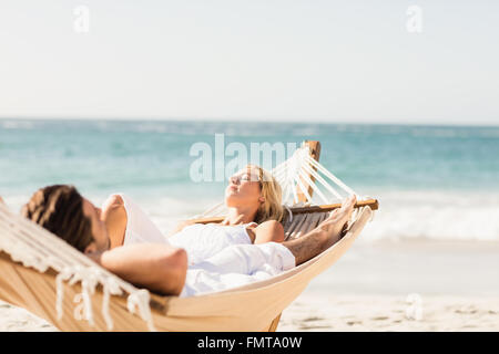 Couple sleeping in hammock Stock Photo