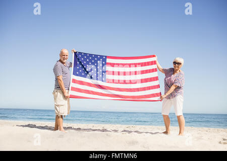 Senior couple holding american flag together Stock Photo