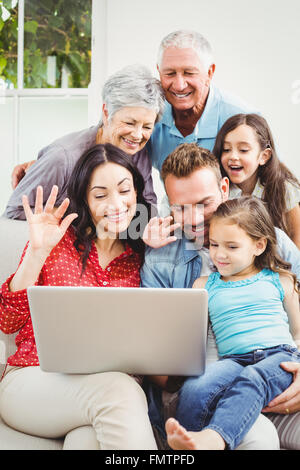 Multi-generation family using laptop Stock Photo - Alamy