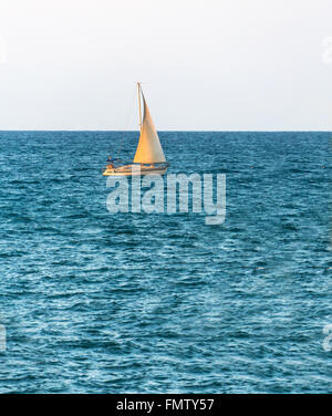 seascape, boat with a sail on the high seas Stock Photo