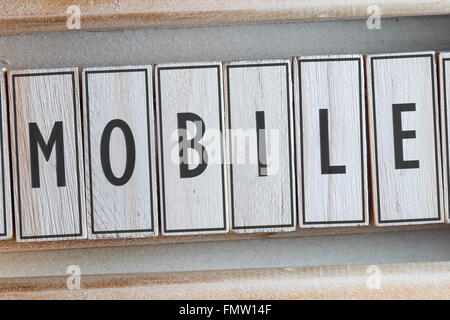 Mobile word written on wood Stock Photo