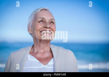Senior woman smiling and looking away Stock Photo