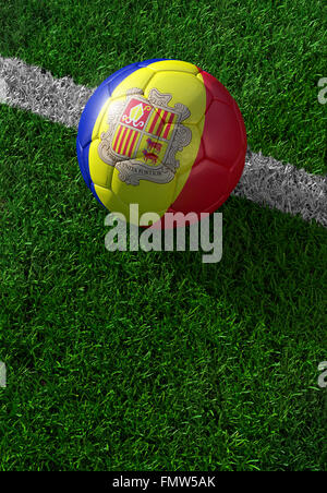 Soccer ball and national flag of Andora lies on the green grass Stock Photo