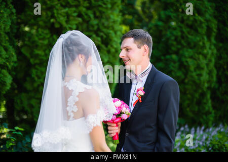 bride to  groom under the veil Stock Photo