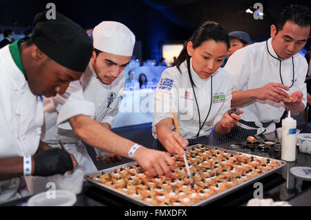 Los Angeles, USA. 12th Mar, 2016. Cooks prepare food as five top chefs in Asian cuisine present a mixed-styled dinner at East West Masters Dinner night held during All-star Chef Classic Los Angeles in Los Angeles, the United States, on March 12, 2016. © Zhang Chaoqun/Xinhua/Alamy Live News Stock Photo