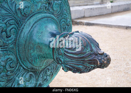 Paris - The detail of bronze old gun in front of Ecole Militaire building. Stock Photo
