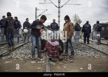 Idomeni, Greece. 12th Mar, 2016. Thousands of refugees from Syria are locked in Idomeni on the border between Greece and Macedonia. The borders are closed, the hygienic and sanitary conditions are poor, many volunteers are helping in every way the thousands of men, women and children stuck between the railroad tracks. © Davide Bosco/Pacific Press/Alamy Live News Stock Photo
