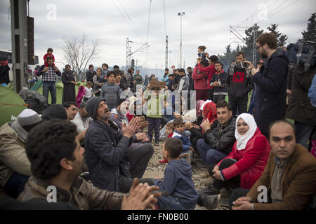 Idomeni, Greece. 12th Mar, 2016. Thousands of refugees from Syria are locked in Idomeni on the border between Greece and Macedonia. The borders are closed, the hygienic and sanitary conditions are poor, many volunteers are helping in every way the thousands of men, women and children stuck between the railroad tracks. © Davide Bosco/Pacific Press/Alamy Live News Stock Photo