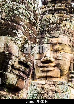 Giant stone carving of smiling face at Bayon Temple in Siem Reap, Cambodia Stock Photo