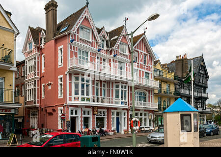 An attractive pink and white building built in 1889 close to the river and now being used as a public house serving light meals Stock Photo