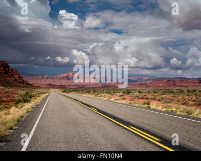 Road and mountains with storm clouds. Scenic Byway Hwy 95, Glen Canyon National Recreation Area, Utah Stock Photo