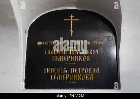 Grave of Russian general Timofey Semernikov in the underground crypt of the Dormition Church at the Olsany Cemetery in Prague, Czech Republic. Major general Timofey Avramievich Semernikov was a principal of the Don Cossacks Cadet Corps in Novocherkassk, Russia. He lived in exile in Czechoslovakia after the Bolshevik Revolution and died on September 23, 1949. His wife Yevgenia Petrovna Semernikova, who died on March 2, 1956, was buried in the same burial niche late. The Dormition church at the Olsany Cemetery was built in 1924-1925 by the Russian white emigre. The underground crypt was used as Stock Photo