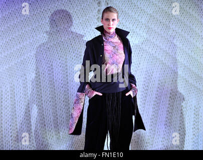 Apolda, Germany. 12th Mar, 2016. A model wears a student's design at a fashion show at the closing of the 16th knitting and textile workshop in Apolda, Germany, 12 March 2016. Over the course of the week, a total of 18 students from the Trier University of Applied Sciences, the Berlin Weissensee School of Art, the ESMOD Paris (France), and the Politecnica Madrid (Spain) were able to turn their ideas into collections in regional knitting and textile firms. Photo: MARTIN SCHUTT/dpa/Alamy Live News Stock Photo