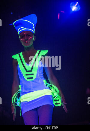 A model walks across the catwalk during a blacklight fashion show for the opening of the 'Luminale' light spectacle in Offenbach, Germany, 12 March 2016. This year's Luminale takes place from 13 to 18 March 2016 and features around 200 light installations in Frankfurt and Offenbach. Photo: BORIS ROESSLER/dpa Stock Photo