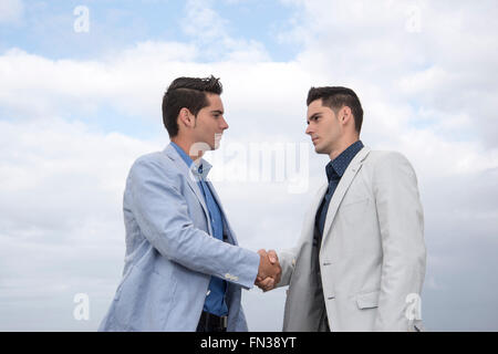 Two young Latin executives outdoors Stock Photo