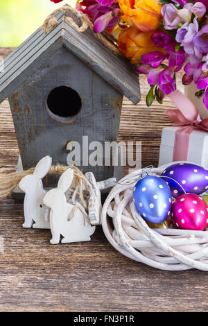 Spring rabbits with easter eggs Stock Photo