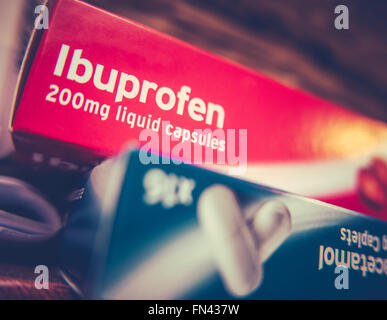 Painkillers Ibuprofen And Paracetamol On A Shelf At Home Stock Photo