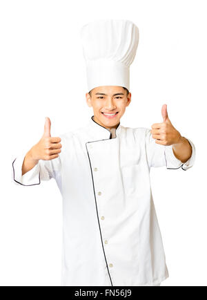 young  male chef with thumb up isolated on white Stock Photo