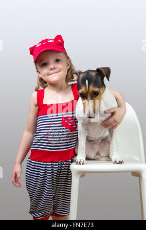 little girl with her Jack Russell Terrier studio Stock Photo
