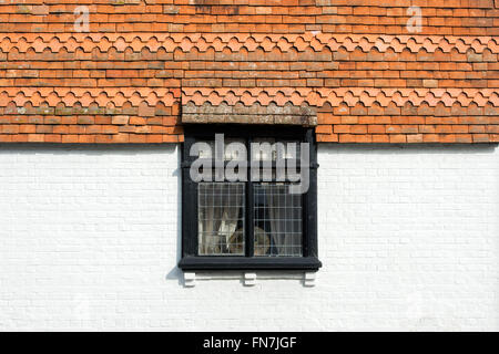Wall tiles leaded window detail on a house in Dorchester on Thames, Oxfordshire, England Stock Photo