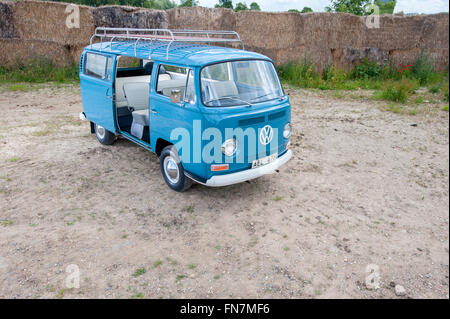 A blue Volkswagen VW type 2 bay camper van with Comic eyes on the ...